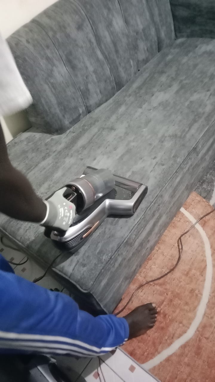 FreshDream technician cleaning sofa with JIMMY BX7 Pro Max