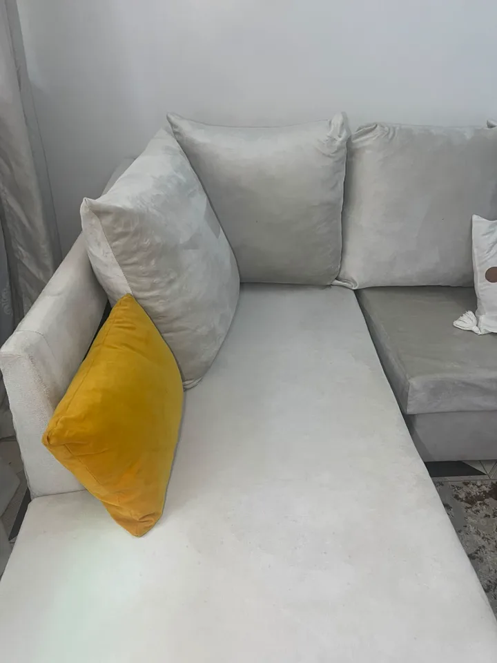 A freshly cleaned light-coloured sofa after FreshDream service